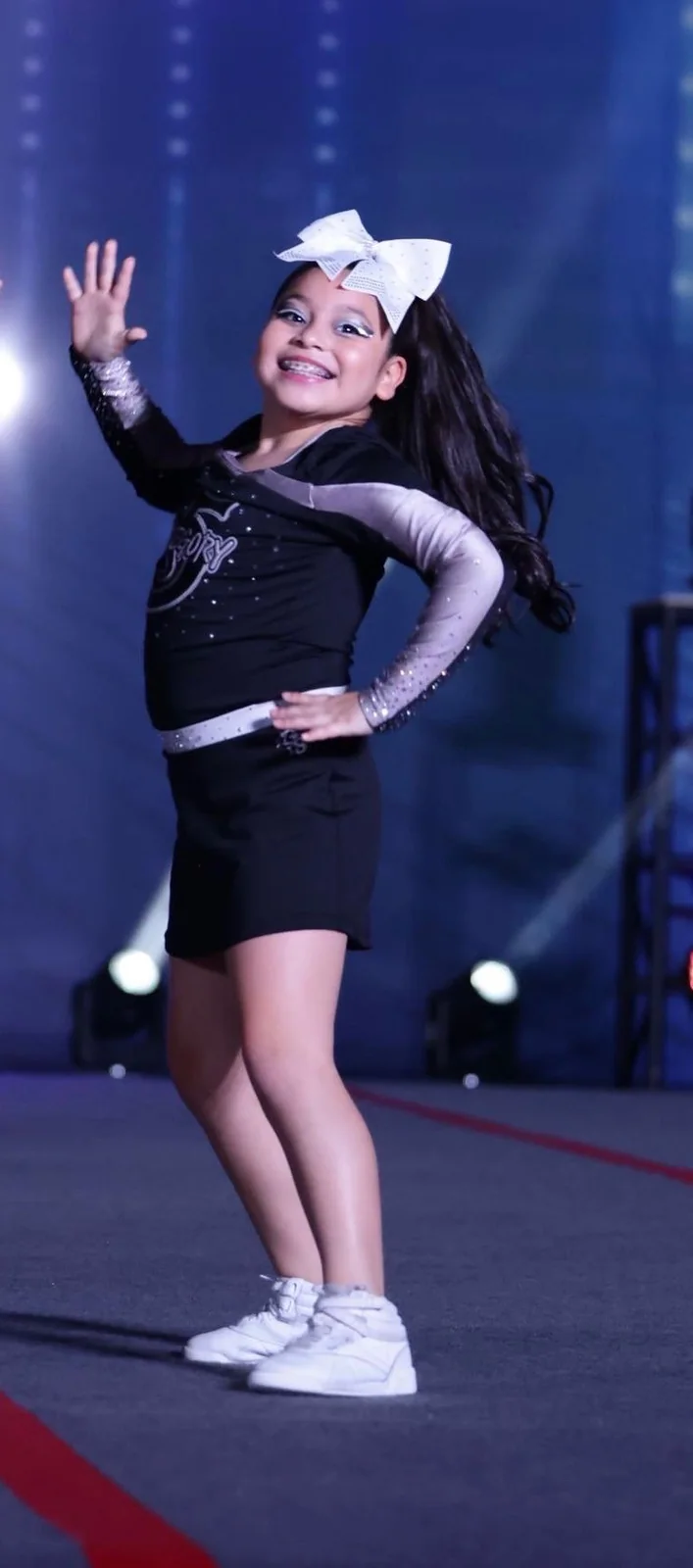 A Category 5 athlete performing confidently in uniform under competition lights